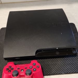 PS3 Slim Console with wireless controller.